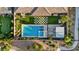 Aerial view of an impeccable backyard showcasing a pool, spa, fire pit, and outdoor kitchen at 9972 Terrastone Dr, Las Vegas, NV 89148