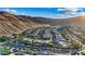 Primary-planned community with mountains in the background and desert landscaping throughout the neighborhood at 9972 Terrastone Dr, Las Vegas, NV 89148