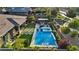 Aerial view of a private backyard with a swimming pool, spa, outdoor kitchen, and manicured landscaping at 9972 Terrastone Dr, Las Vegas, NV 89148