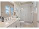 Modern bathroom featuring a glass-enclosed shower, single vanity, and well-lit mirror at 9972 Terrastone Dr, Las Vegas, NV 89148