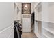 Well-organized walk-in closet with custom shelving, drawers, and hanging space for optimal storage at 9972 Terrastone Dr, Las Vegas, NV 89148