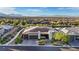 Single-story home featuring modern architecture, a desert landscape, and a three-car garage at 9972 Terrastone Dr, Las Vegas, NV 89148