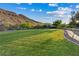 Community green space for outdoor activities with walking paths and mountain views at 9972 Terrastone Dr, Las Vegas, NV 89148