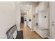 Hallway featuring a bench with storage and access to the home office and other living spaces at 9972 Terrastone Dr, Las Vegas, NV 89148