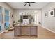 Spacious home office featuring natural light, built-in storage, and a large desk for remote work at 9972 Terrastone Dr, Las Vegas, NV 89148