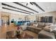 Expansive open-concept living space with exposed wood beams, updated kitchen and a generous sectional sofa at 9972 Terrastone Dr, Las Vegas, NV 89148