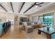 Spacious open-concept living area with a gourmet kitchen, dining space, and comfortable lounge area at 9972 Terrastone Dr, Las Vegas, NV 89148