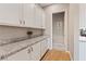 Spacious pantry with granite countertops and ample storage cabinets perfect for kitchen organization at 9972 Terrastone Dr, Las Vegas, NV 89148