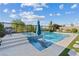Enjoy this sparkling pool with a water feature and in-pool lounge chairs at 9972 Terrastone Dr, Las Vegas, NV 89148