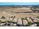 Aerial view of homes, highlighting the neighborhood layout, landscaping, and open spaces with mountains in background at 10621 Tinta Ln, Las Vegas, NV 89144