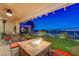Inviting covered patio with fire pit and comfortable seating offering stunning city views at 10621 Tinta Ln, Las Vegas, NV 89144