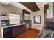 Modern kitchen with dark wood cabinets, granite countertops, and stainless steel appliances at 10621 Tinta Ln, Las Vegas, NV 89144