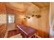 Tranquil room with massage table, wood-paneled walls, and natural light from outdoor access at 10621 Tinta Ln, Las Vegas, NV 89144