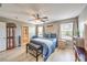 Charming bedroom featuring a queen bed, wood floors, and natural light at 10961 Winter Rise St, Las Vegas, NV 89141