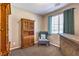 Bedroom featuring a chair, desk, hutch and window with blinds at 10961 Winter Rise St, Las Vegas, NV 89141