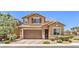 Inviting two-story home with a meticulously maintained front yard and attached two-car garage at 10961 Winter Rise St, Las Vegas, NV 89141