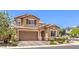 Charming two-story home featuring a large two-car garage, tidy landscaping, and cozy curb appeal at 10961 Winter Rise St, Las Vegas, NV 89141