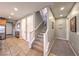 Hallway with staircase leading upstairs and tile flooring to kitchen at 10961 Winter Rise St, Las Vegas, NV 89141