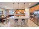 Spacious kitchen featuring a large granite island, stainless steel appliances, and ample cabinetry at 10961 Winter Rise St, Las Vegas, NV 89141