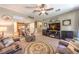 Inviting living room flows into the kitchen, featuring comfortable seating and stylish decor at 10961 Winter Rise St, Las Vegas, NV 89141
