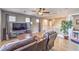 Upstairs living room with dark brown recliners and a large TV at 10961 Winter Rise St, Las Vegas, NV 89141