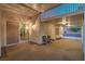 Covered back patio featuring neutral tones and multiple seating areas at 1145 Glacier Park Ct, Henderson, NV 89052
