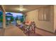 Inviting covered back patio with an outdoor seating area and heat source at 1145 Glacier Park Ct, Henderson, NV 89052