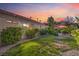 Beautiful lawn and backyard with mature shrubs and gravel at 1145 Glacier Park Ct, Henderson, NV 89052