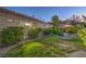 Spacious backyard with lush landscaping, fenced pool area, and covered patio perfect for outdoor entertaining at 1145 Glacier Park Ct, Henderson, NV 89052