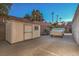 View of backyard featuring storage shed next to trailer covered with tarp at 1145 Glacier Park Ct, Henderson, NV 89052