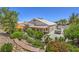 Backyard with mature landscaping, covered patio, and additional parking at 1145 Glacier Park Ct, Henderson, NV 89052