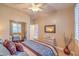 Bedroom featuring a mirrored closet, large window, and bright, neutral walls at 1145 Glacier Park Ct, Henderson, NV 89052
