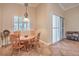 Cozy breakfast nook area with a round wood table and window shuttering at 1145 Glacier Park Ct, Henderson, NV 89052
