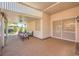 Large covered patio with comfortable seating and views of the manicured backyard at 1145 Glacier Park Ct, Henderson, NV 89052