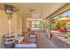 Inviting covered patio with ample seating and views of the landscaped backyard at 1145 Glacier Park Ct, Henderson, NV 89052