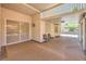 Spacious covered patio with neutral tones and serene views of the lush landscaping at 1145 Glacier Park Ct, Henderson, NV 89052