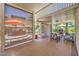 Relaxing covered patio area perfect for entertaining, featuring shade screens and outdoor furniture at 1145 Glacier Park Ct, Henderson, NV 89052