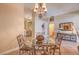Stylish dining area with a glass-top table, decorative accents, and open layout at 1145 Glacier Park Ct, Henderson, NV 89052