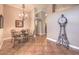 Elegant dining room with a chandelier, ornate table, and decorative accents at 1145 Glacier Park Ct, Henderson, NV 89052