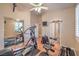 Exercise room featuring workout equipment, mirrored closet, and ample natural light at 1145 Glacier Park Ct, Henderson, NV 89052