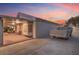 Home exterior with covered patio, and covered utility trailer at 1145 Glacier Park Ct, Henderson, NV 89052