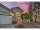 Inviting single-story home featuring a well-manicured lawn, mature tree, and a lovely front facade at 1145 Glacier Park Ct, Henderson, NV 89052