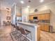 Modern kitchen with granite counters, stainless appliances and bar seating at 1145 Glacier Park Ct, Henderson, NV 89052