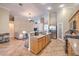 Open-concept kitchen with stainless steel appliances, a breakfast bar, and seamless connection to the living area at 1145 Glacier Park Ct, Henderson, NV 89052
