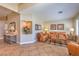 Cozy living room featuring tile floors, comfortable seating, and stylish decor at 1145 Glacier Park Ct, Henderson, NV 89052
