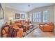 Spacious living room showcasing windows, furniture and neutral decor at 1145 Glacier Park Ct, Henderson, NV 89052
