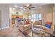 Inviting living room featuring neutral decor, comfortable seating, and an open floor plan that flows into the kitchen at 1145 Glacier Park Ct, Henderson, NV 89052