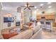 Open-concept living space with a fireplace, built-ins, and a breakfast bar at 1145 Glacier Park Ct, Henderson, NV 89052