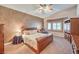 Comfortable main bedroom featuring warm earth tones, lots of space, and natural light for a calm and relaxing atmosphere at 1145 Glacier Park Ct, Henderson, NV 89052