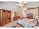 The main bedroom has a neutral color scheme, carpeted floors, and dark wood furniture at 1145 Glacier Park Ct, Henderson, NV 89052